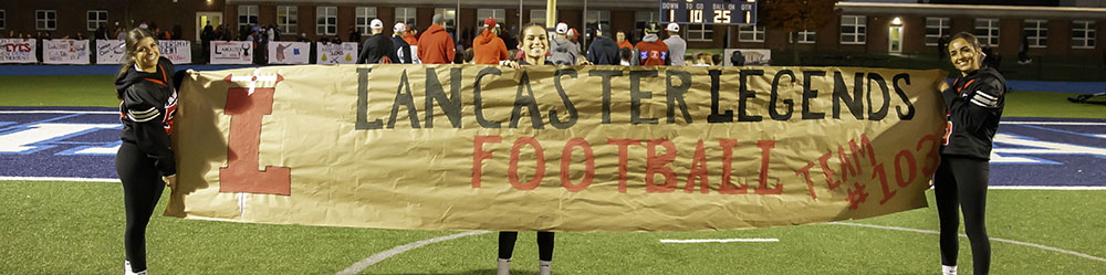 Lancaster Cheerleaders holding a sign, Lancaster Legends Football Team 103