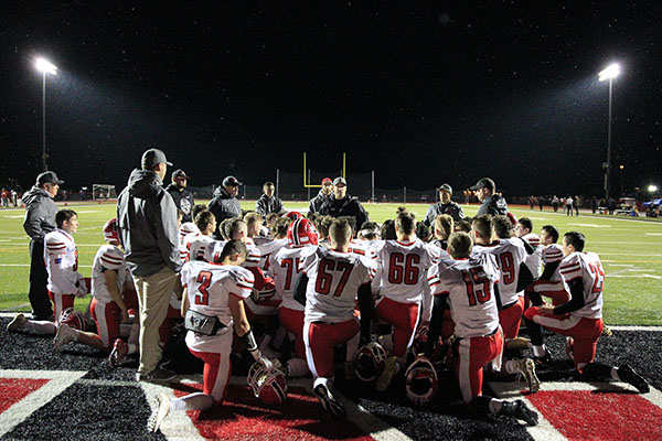 Post game huddle after the victory