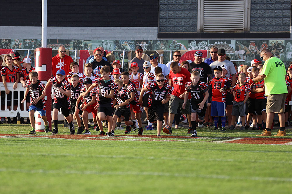 Lancaster Youth Football Youngsters running on the field