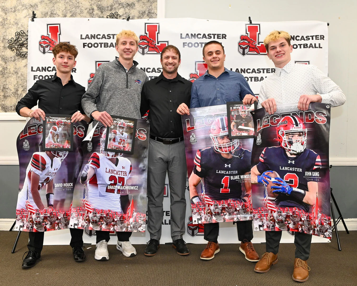 Coach with players with banners