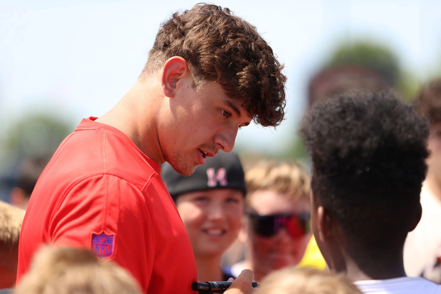 Joe Andreessen signing autographs to the campers