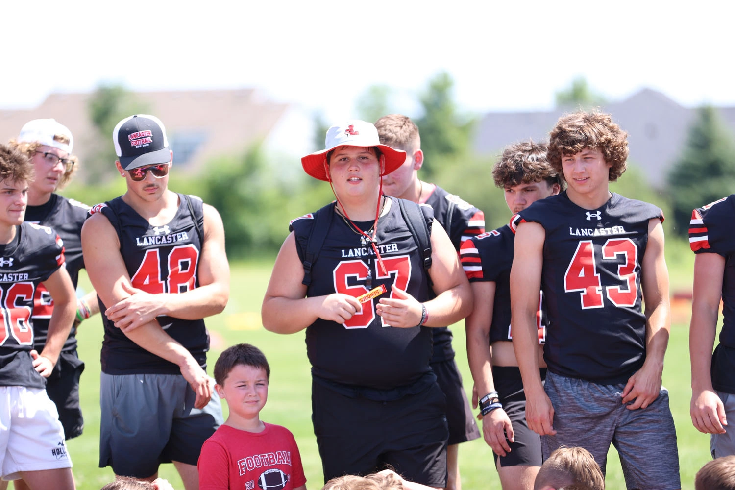 Varsity player calling campers of the day