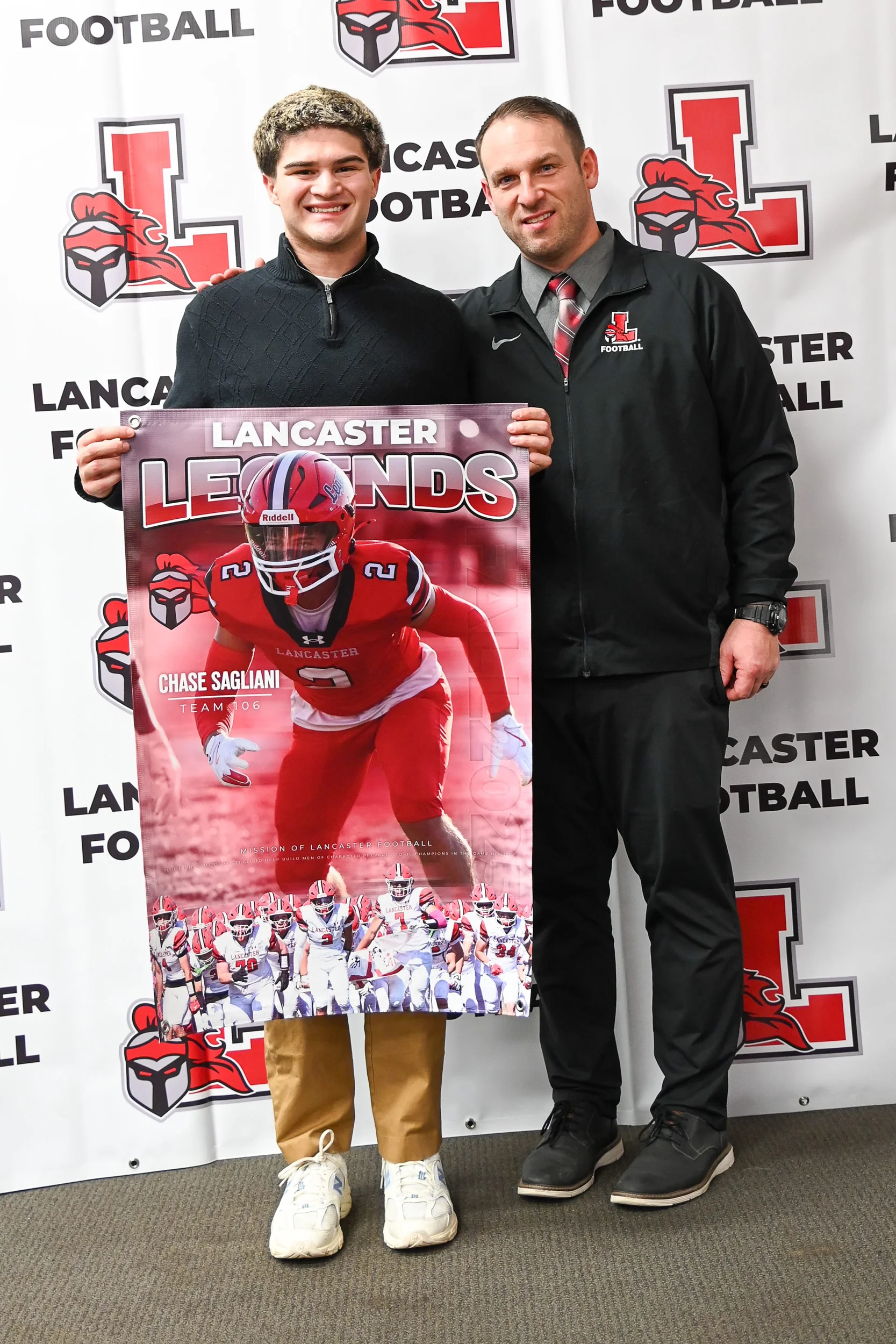 Chase holding his banner with Coach Rupp