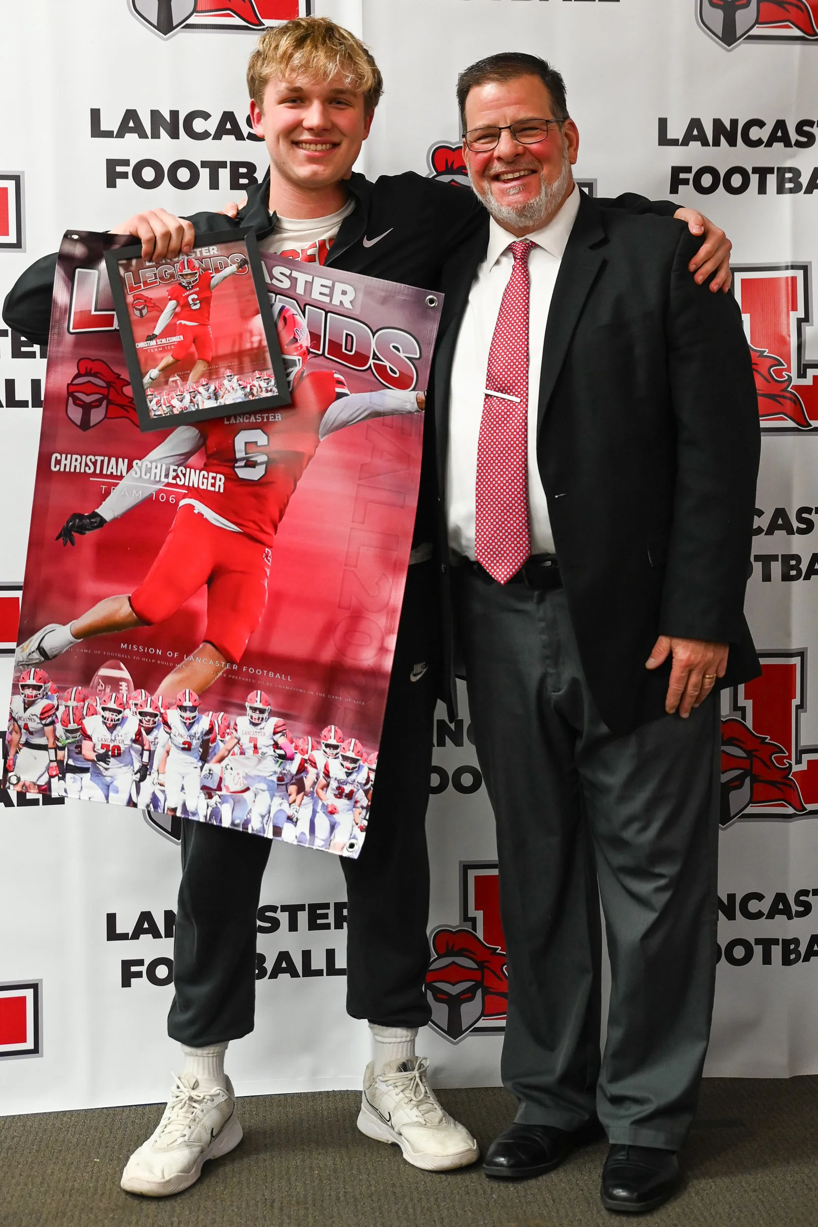 Schlesinger holding his banner with Coach Wild
