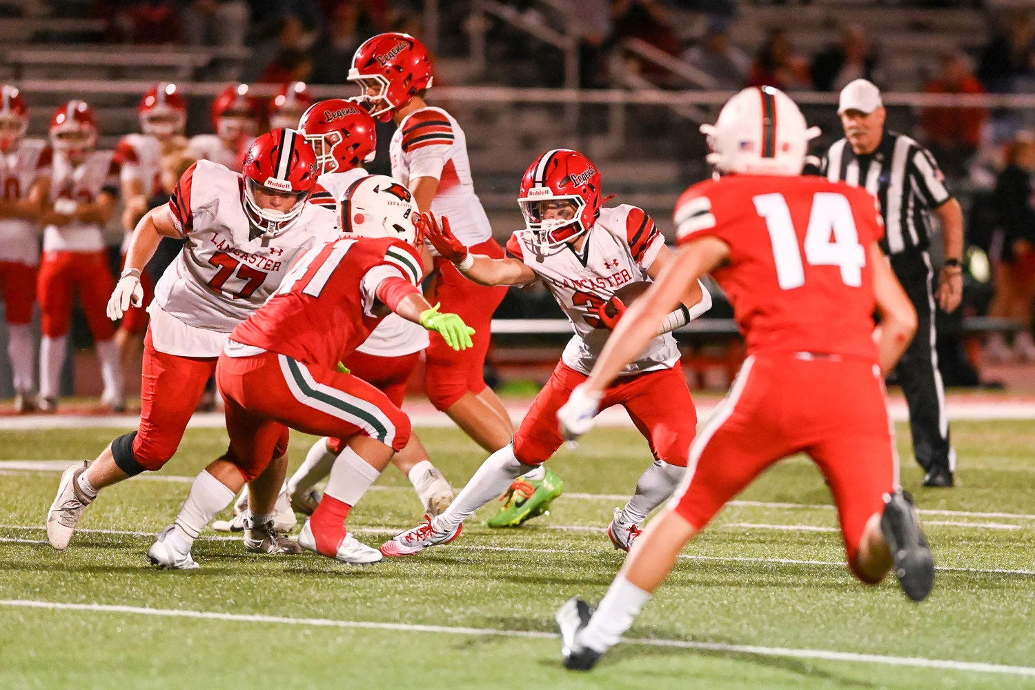 Stiff arm against the defense