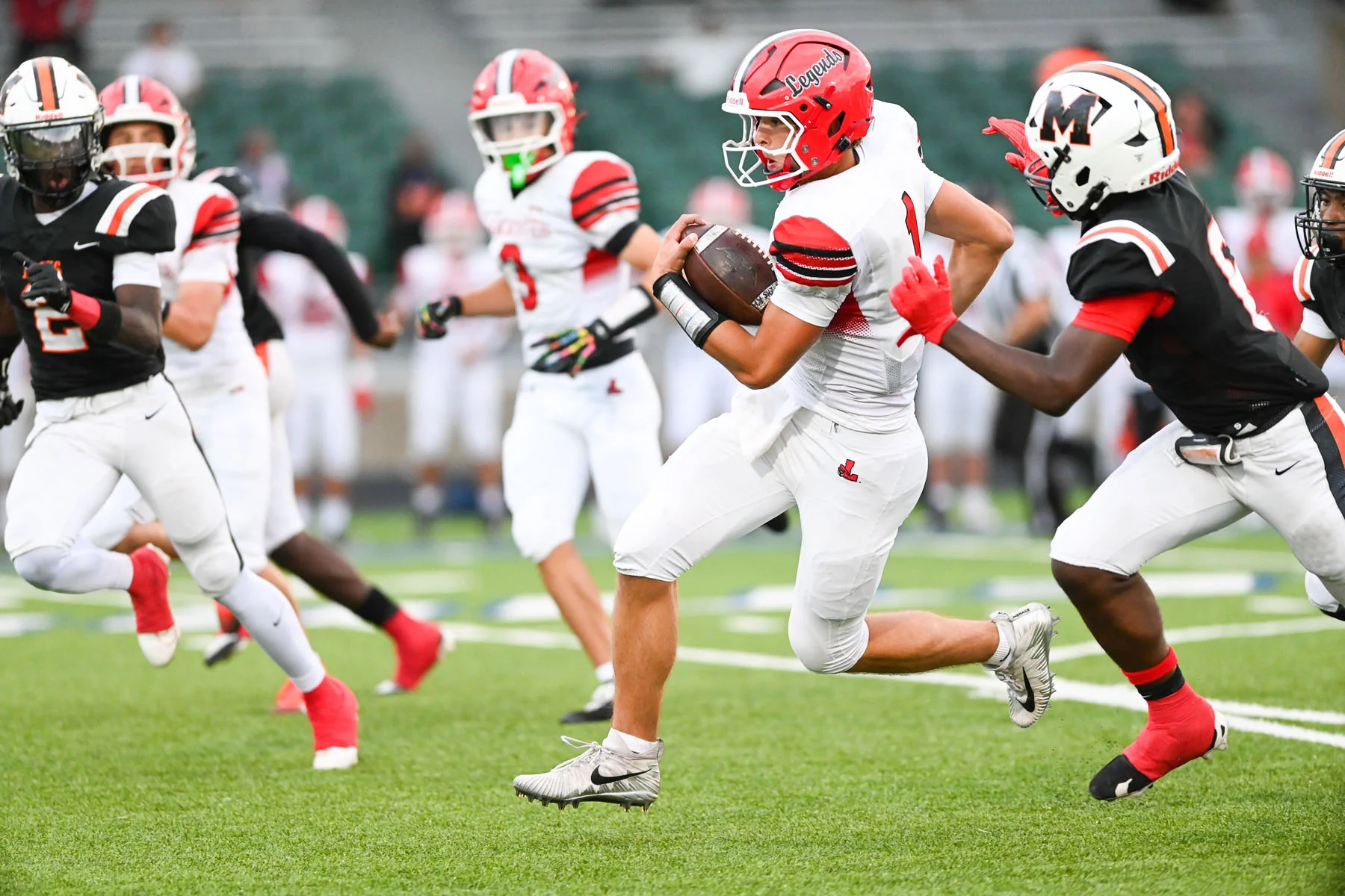 Ball carrier running down the field avoiding the defense
