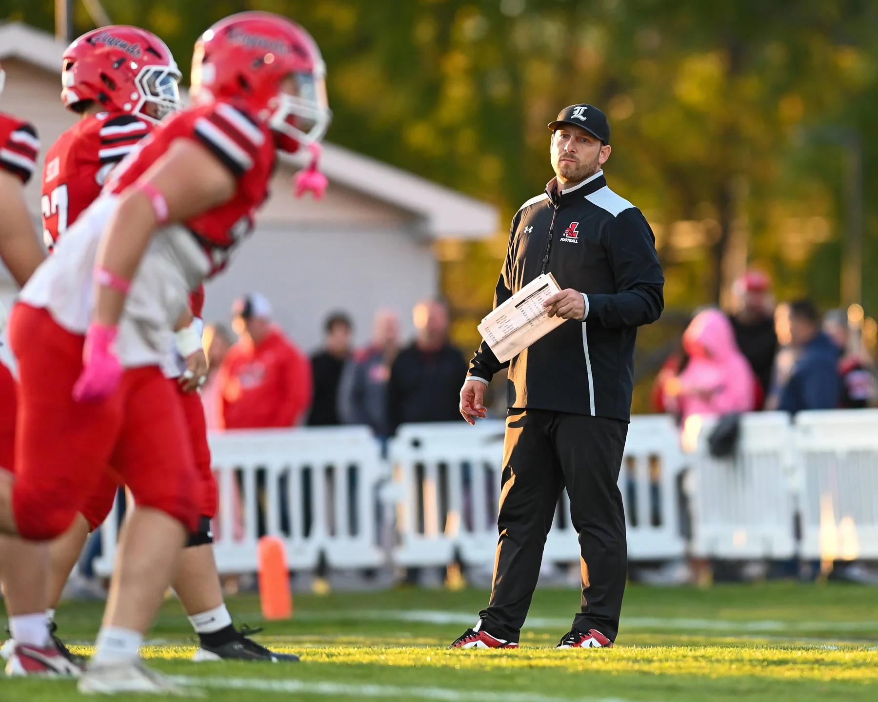 Coach looking over the team
