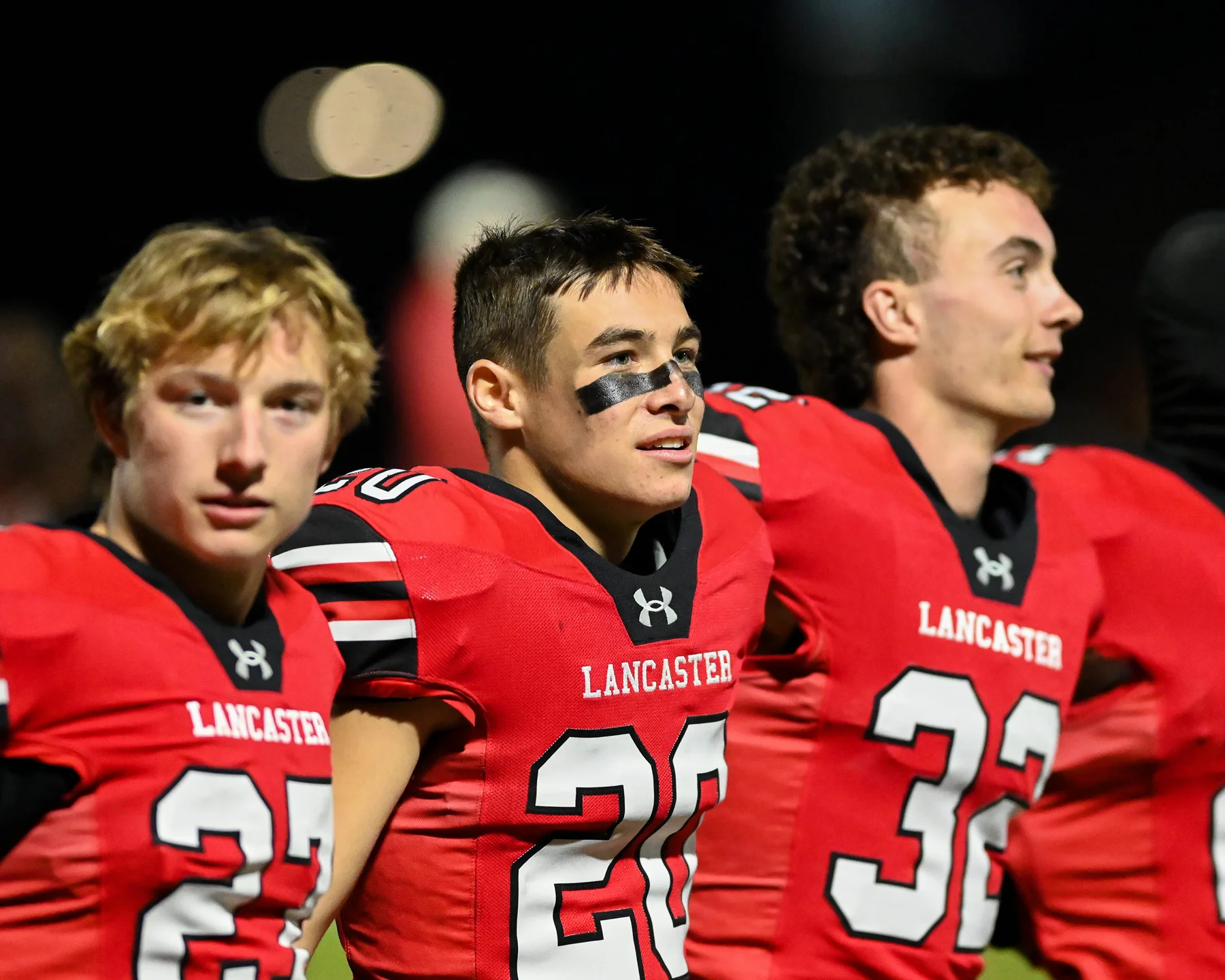 Team sings the schools alma mater