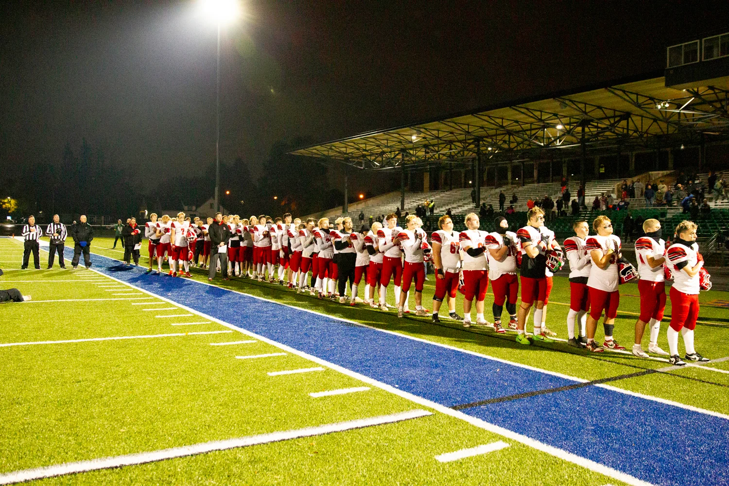 Lancaster standing during the National Anthem