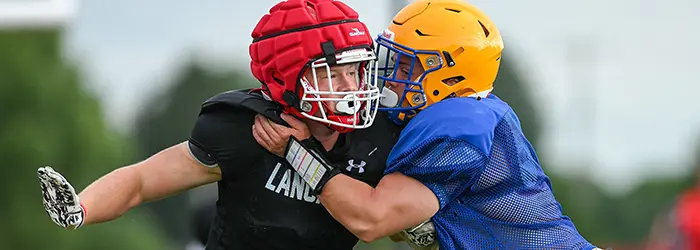 Lancaster DL rushing the QB